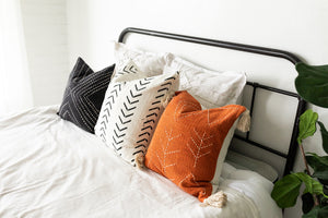 boho chic pillows on bed