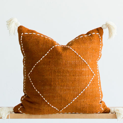 boho throw pillows rust with stitched motif