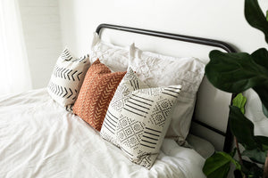farmhouse throw pillows on bed