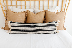lumbar throw pillow on bed